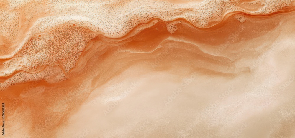 Fototapeta premium warm orange and cream marble-like texture with foamy bubbles, flowing waves and smooth swirls, evoking calm organic fluid motion