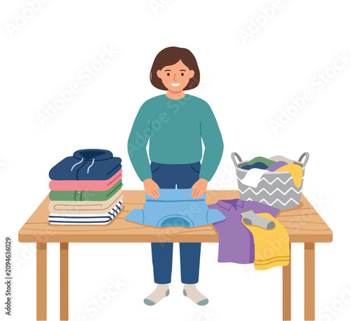 Cuadro en lienzo Simple flat illustration of folding some clean clothes into a neat stacks on the table, modern vector style, no outline, white background