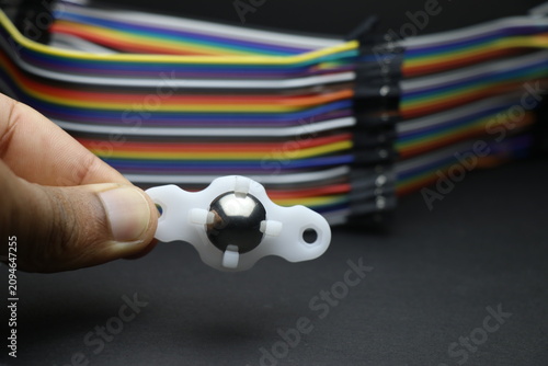 small caster wheel used in robotic diy projects held in hand