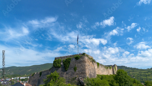 Bilde på lerret Aerial View of Historic Jajce Fortress with Bosnian Flag in Bosnia and Herzegovi