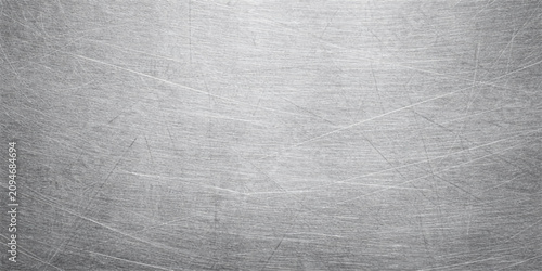 Silver scratched metal texture background with brushed steel surface and industrial worn effect design