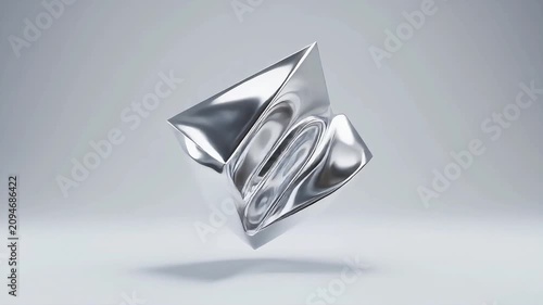 Rotating abstract metallic object with changing geometric shape