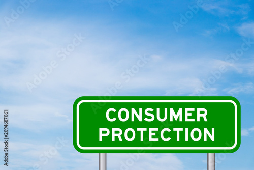 Green color transportation sign with word consumer protection on blue sky with white cloud background