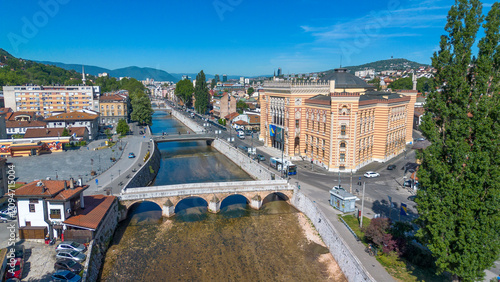 Drone view of Sarajevo City Hall Vijecnica and historic Latin Bridge over Miljacka river