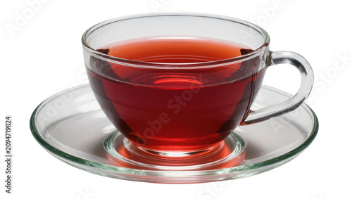 Isolated clear glass teacup with vibrant red tea and matching transparent saucer for refreshing drink