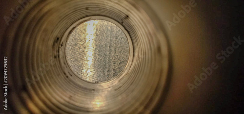 Foto Creative macro photography looking inside an empty thread spool against an illum