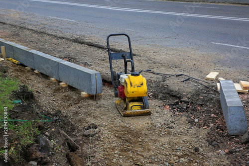 Photos car road construction curb laying