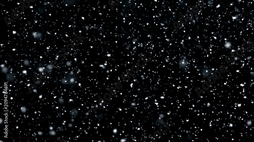 Falling snow isolated on black background