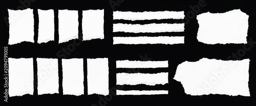 Various rectangular and strip-like white paper pieces