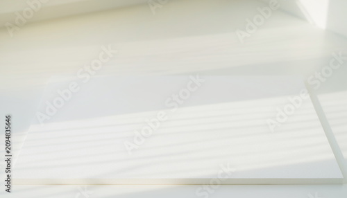 Obraz na płótnie White paper mockup with soft window shadow overlay 窓の影が落ちる白い紙の背景素材