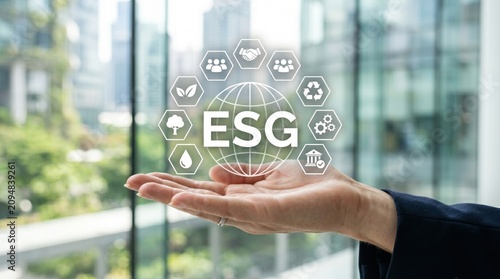 Hand holding virtual globe with ESG text surrounded by hexagonal icons representing environmental social governance sustainability ecology recycling and corporate responsibility