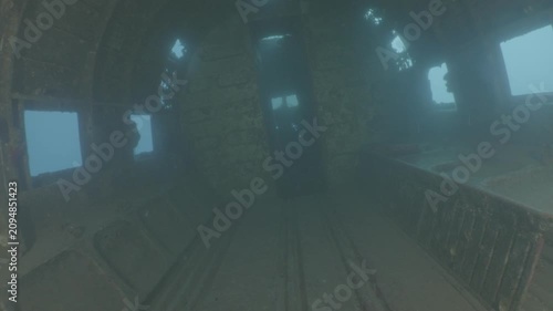 log footage of an airplane wreck underwater scuba divers to explore  metal on ocean floor