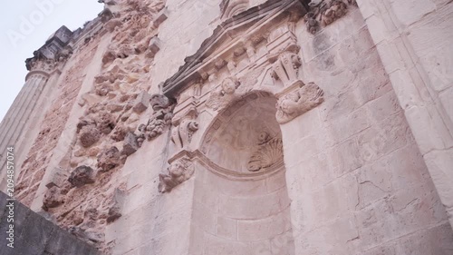 Architectural facade details of the ruined Santa Maria church in Cazorla, Spain