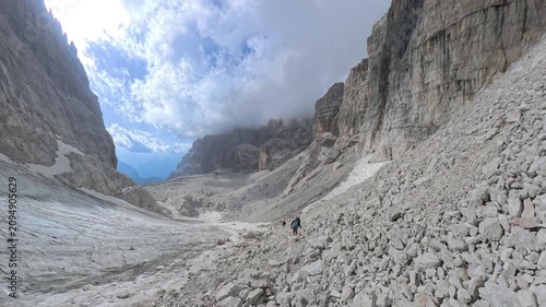 Hikers descending the mountain trail toward Rifugio Alimonta, Via Ferrata Bocchette Centrali, Brenta Dolomites