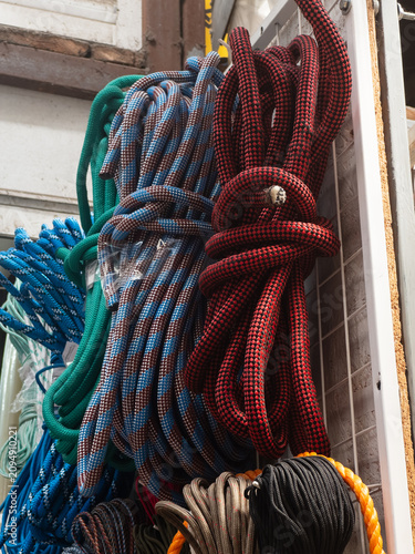 фотографія Colorful braided ropes and utility cords on spools in hardware store