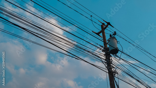 Photos Electricity transmission utility pole featuring a detailed electrical transforme