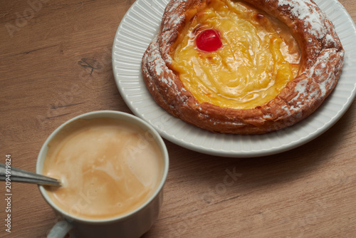 Tableau sur toile Coffee with milk and ensaimada pastry breakfast.