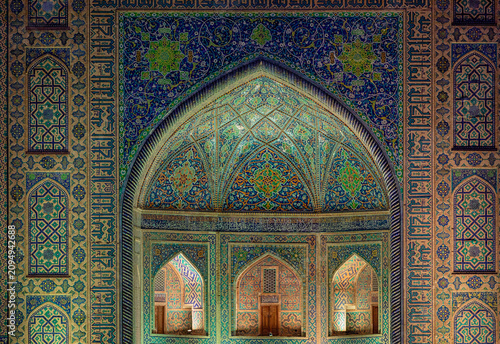 Night image of the beautiful Tilya-Kori madrasah in registan Samarkand.