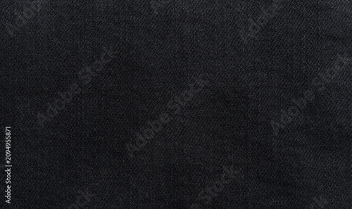 Black denim background, dark jeans fabric macro texture