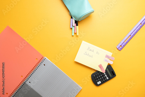 Colorful back to school shopping theme with supplies and to do list notes.