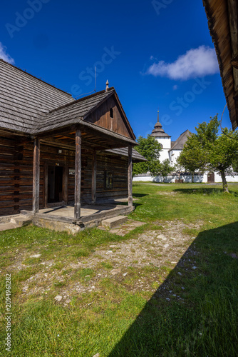 Fotografie Traditional log cabin and church building in Museum of Liptov Village, Pribylina