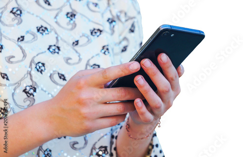 Person typing on a mobile phone screen against a white background.