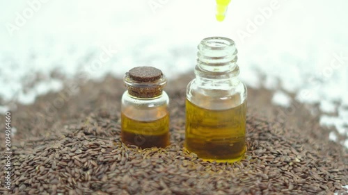 Macro Detail Pan Across Glass Vials of Pure Golden Flaxseed Oil. Alternative Medicine Theme Video Featuring Organic Raw Flaxseed Oil.