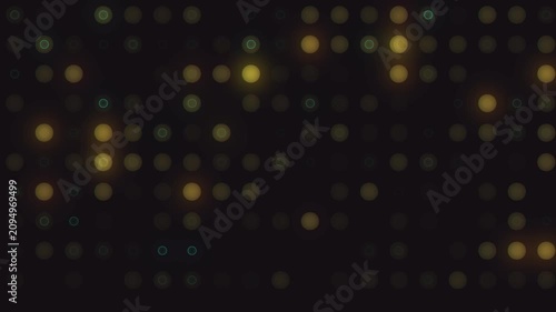 Soft bokeh lights pulsing across dark grid with warm yellow and teal highlights