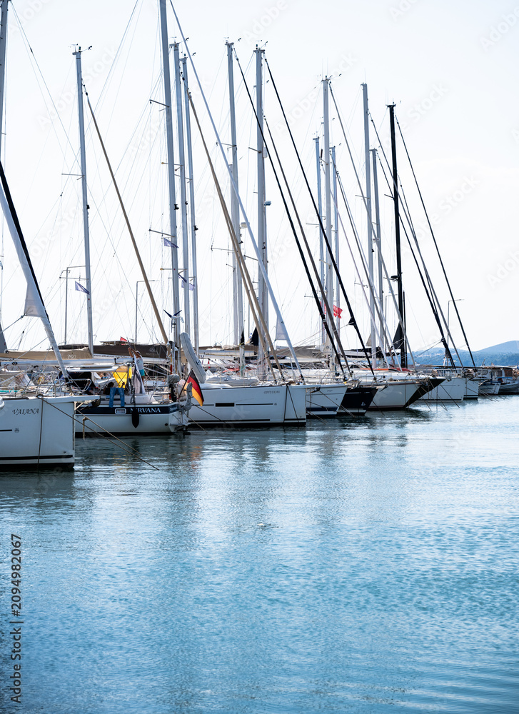Fototapeta premium Nikiti, Greece: sailing boats on clear water