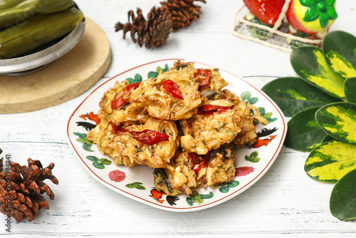 Foto Bakwan, a popular Indonesian fritter, made from a mix of vegetables and wheat flour batter, then deep-fried to golden perfection
