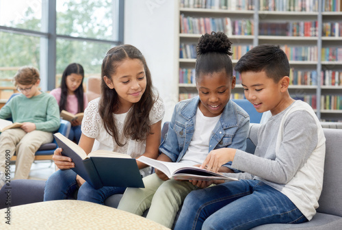 Elementary Students Reading Together in Modern School Library
