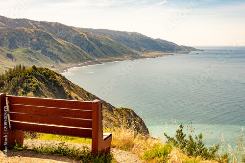 Bench overlook view Pacific Ocean water sea reflection contemplate highway 1 pch