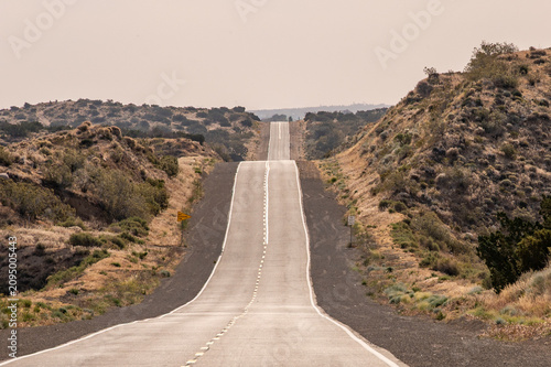 Canvastavla Hilly hill hills distant highway road extends into distance horizon hot desert m