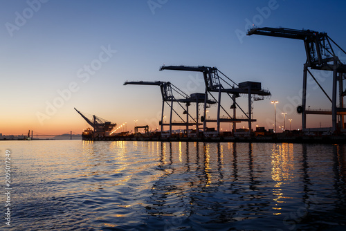 Canvas Print Alameda, California gantry cranes at sunset in San Francisco Bay