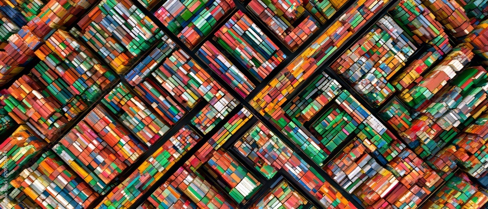 Fototapeta premium Colorful arrangement of many books stacked in a unique pattern at a library or bookstore during the day