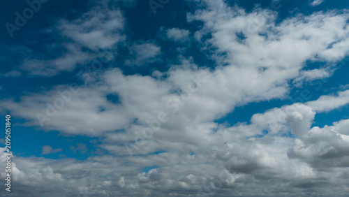 Photography Sunny background, blue sky with white cumulus clouds