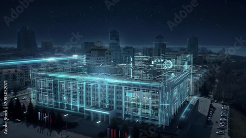 Nighttime city building transforming with glowing cyan wireframe overlay, sweeping digital activation across facades, rooftop, and structure in oblique aerial view