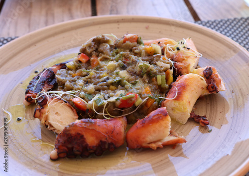 Delicious grilled octopus with roasted vegetables