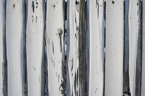 Peeling and weathered fence close-up texture