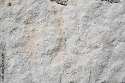 Beige stone brick wall texture close-up 