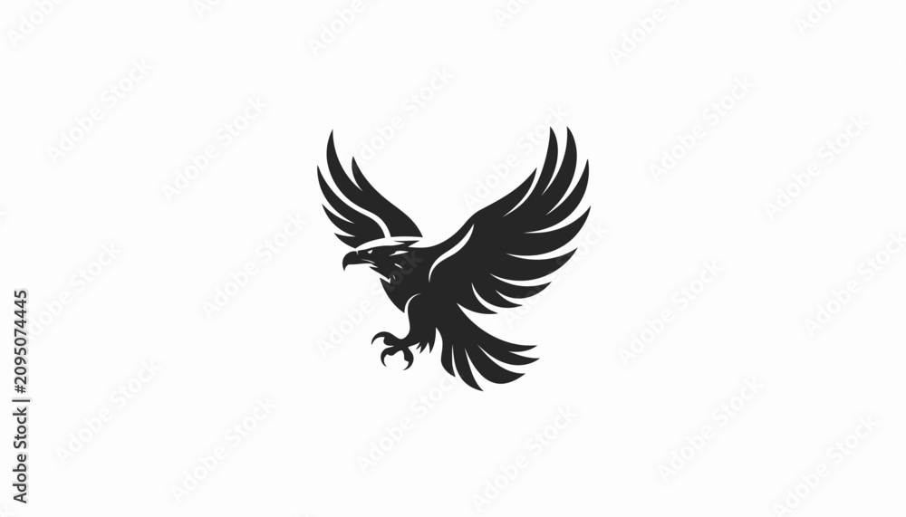 Fototapeta premium Black eagle silhouette with wings spread in flight.