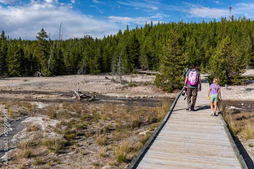 Photos Father and Daughter Walking on Boardwalk Trail, Norris Geyser Basin, Yellowstone