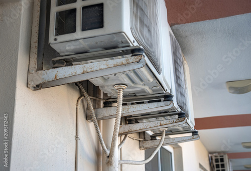 Bild auf Leinwand Air conditioner outdoor unit. air conditioner water drain hose.
