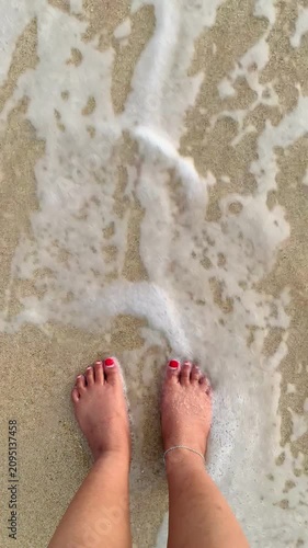 barefoot and waves on the beach, grounding concept.