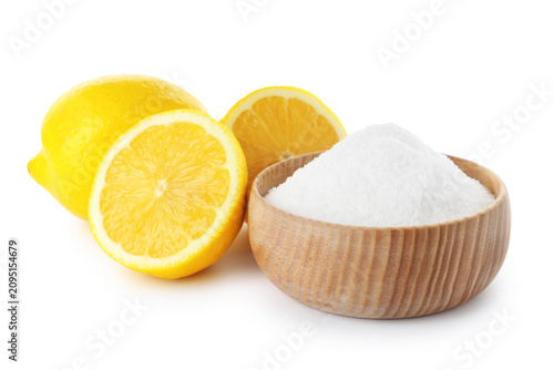 Foto Baking soda and cut lemons on white background