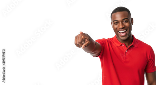 charismatic african-american man in a vibrant red polo smiles widely, pointing forward, isolated on a transparent studio background with left copy space. concept of definitive communication