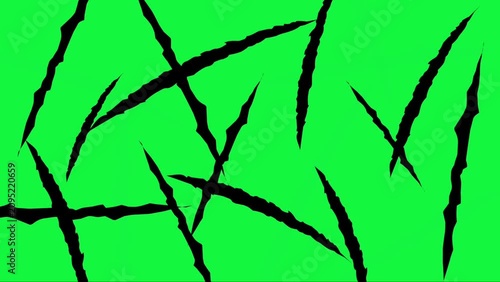 Black animal claw scratches appearing on a green screen
