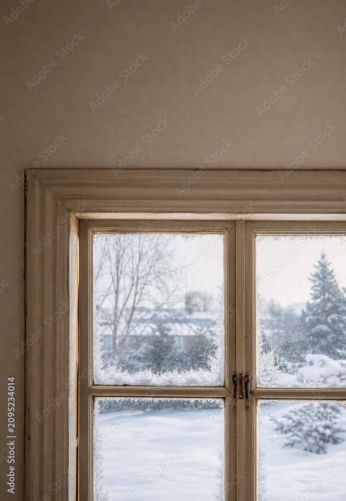 Fototapeta premium Cold Air Entering Through Old Window Frame During Winter Showing Poor Home Insulation and Energy Efficiency Problem