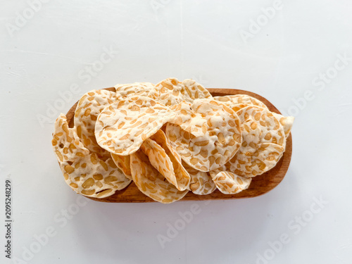 Canvastavla Crispy tempeh chips in wooden bowl, plant-based snack food