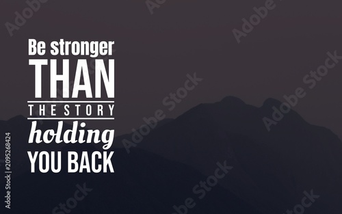 Motivational quote encouraging strength beyond limiting personal stories, designed with bold typography on a dark mountain landscape.